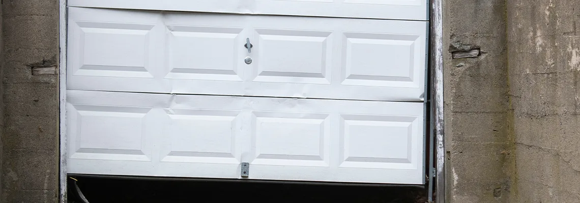 Garage Door Got Hit By A Car Dent Removal in Zion, IL